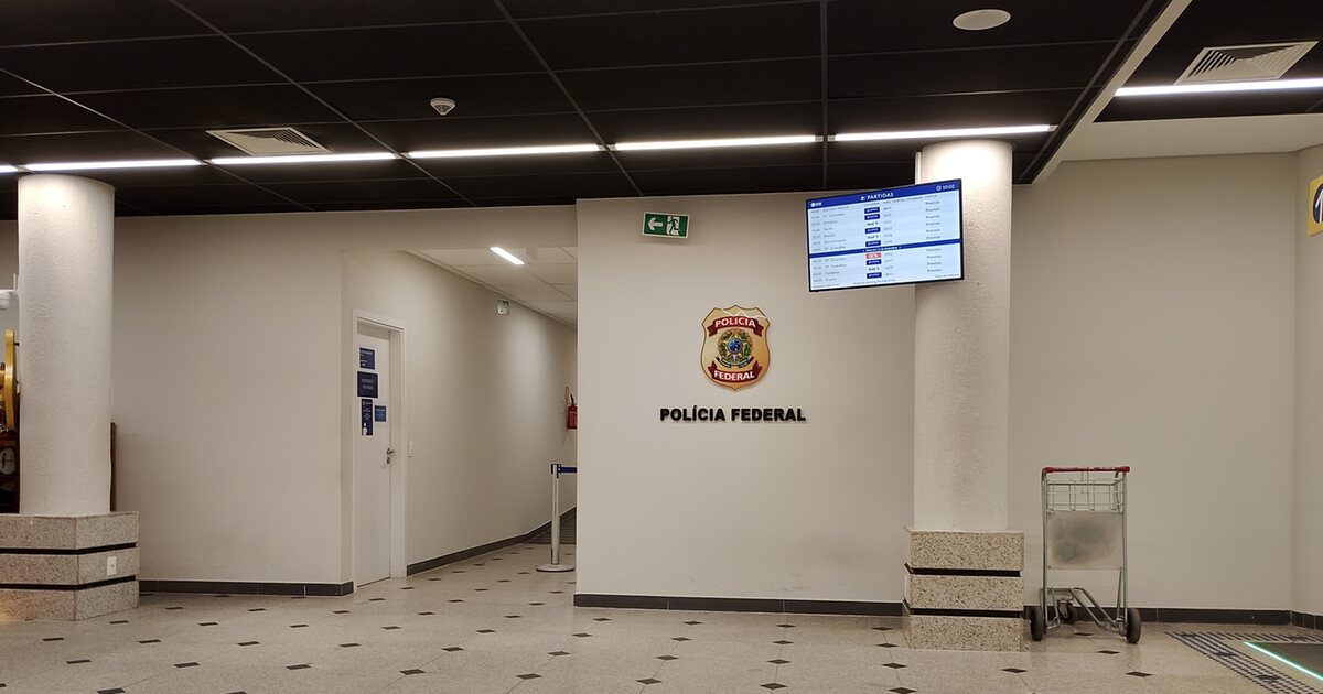 The empty Federal Police post inside the terminal at Teresina airport, its crest and name on the wall beside a departures screen